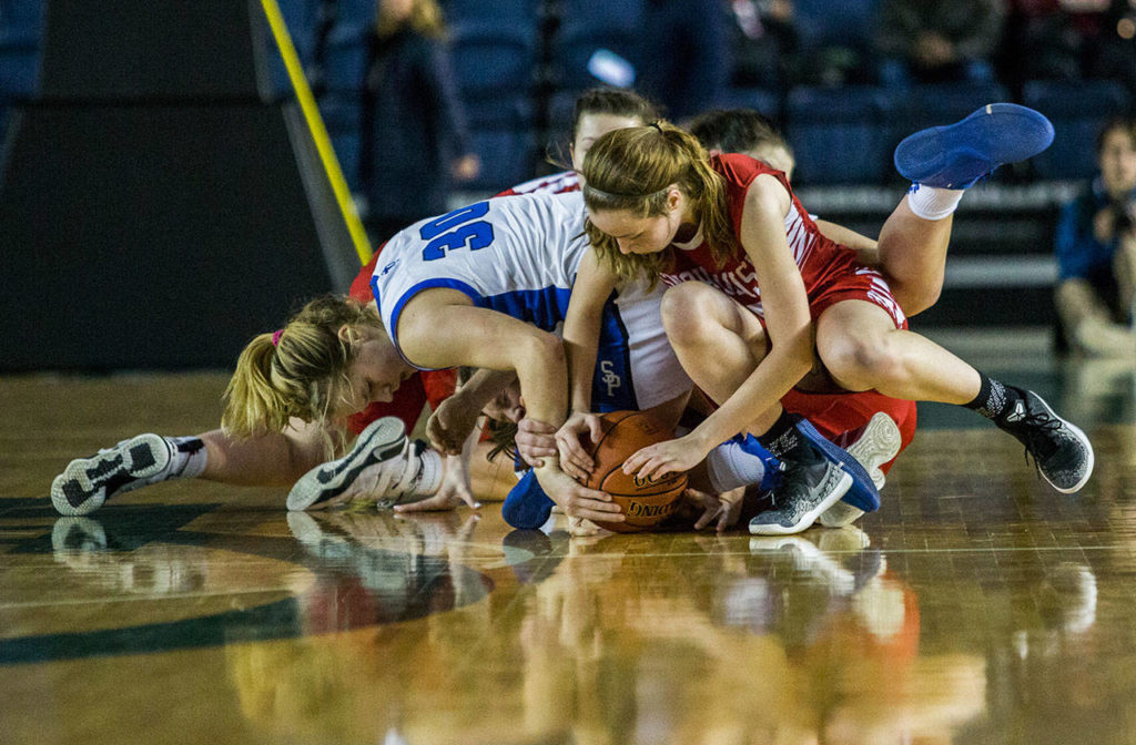 Snohomish and Seattle Prep players scramble for the ball during the game against Seattle Prep at the 3A Girls Hardwood Classic on Wednesday, Feb. 27, 2019 in Tacoma, Wash. (Olivia Vanni / The Herald)
