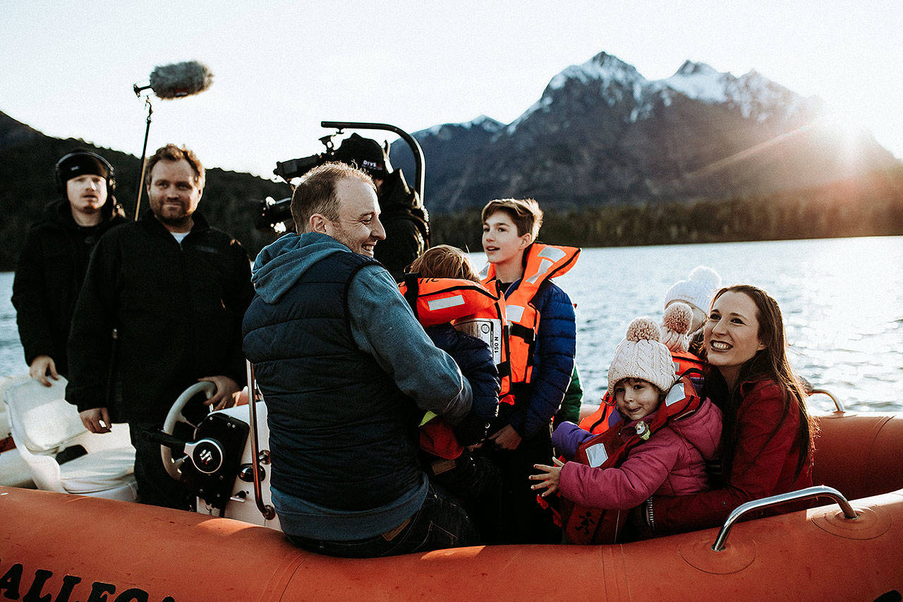 Andy Baldridge and Erica Saar-Baldridge and their children on a boat with a crew from HGTVs House Hunters International. The couple decided to move to the Patagonia region of Argentina in December 2017. (Brianne Belle)