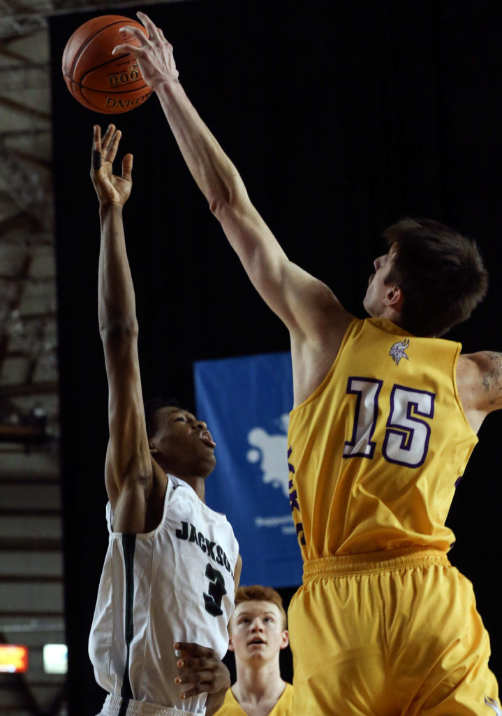 Jackson’s Jaylen Searles shot is blocked by Puyallup’s Zane Foster Wednesday morning at the Tacoma Dome on February 27, 2019. The Timberwolves lost 56-50. (Kevin Clark / The Herald)
