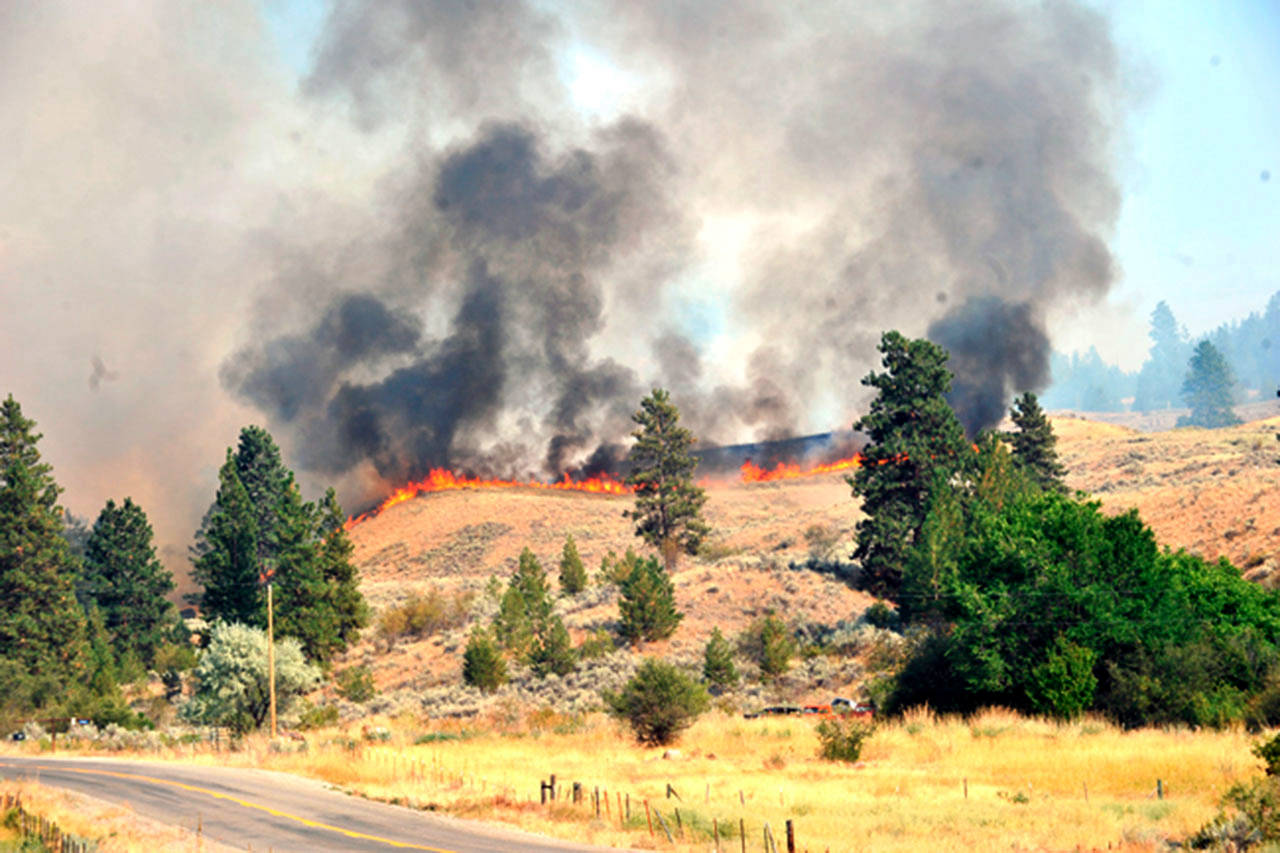 The Nine Mile Fire burned in Okanogan County in 2015. (Gary DeVon / Okanogan Valley Gazette-Tribune, file)