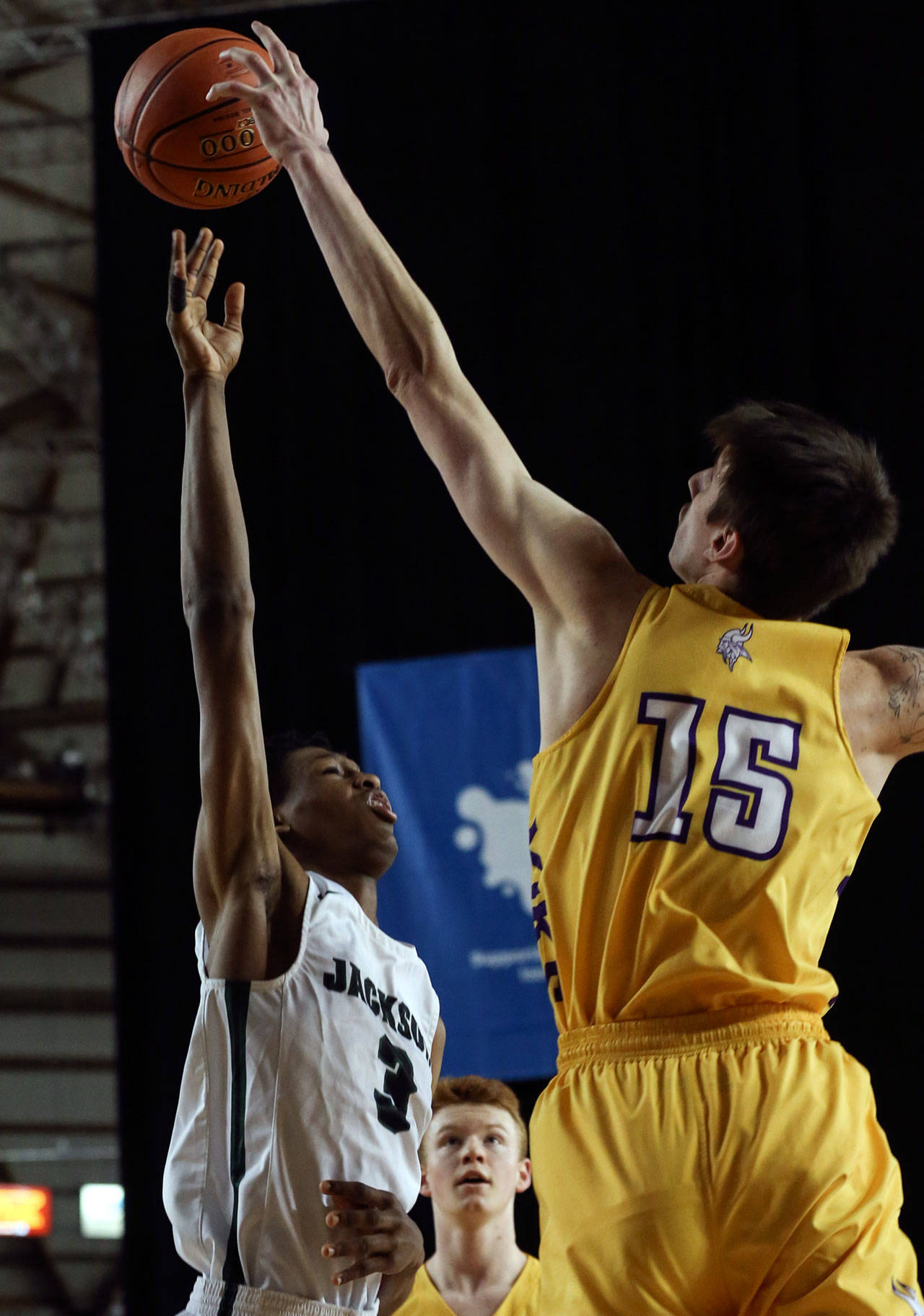 Jackson’s Jaylen Searles shot is blocked by Puyallup’s Zane Foster Wednesday morning at the Tacoma Dome on February 27, 2019. The Timberwolves lost 56-50. (Kevin Clark / The Herald)