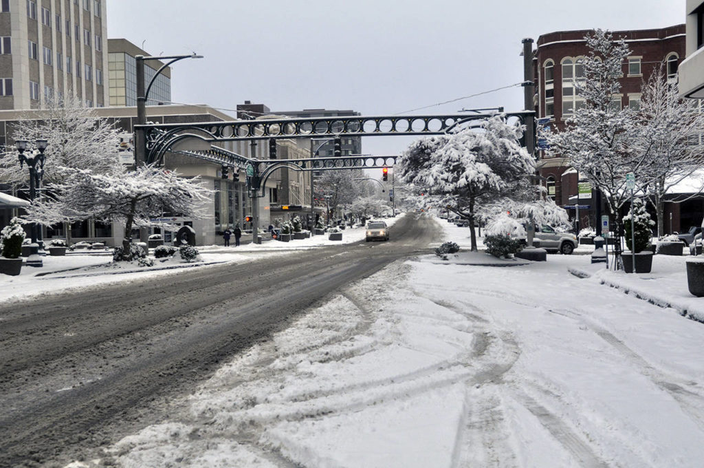 Downtown Everett streets that needed plenty of plowing Feb. 9 are likely to stay clear of snow the rest of the winter. (Sue Misao / The Herald)
