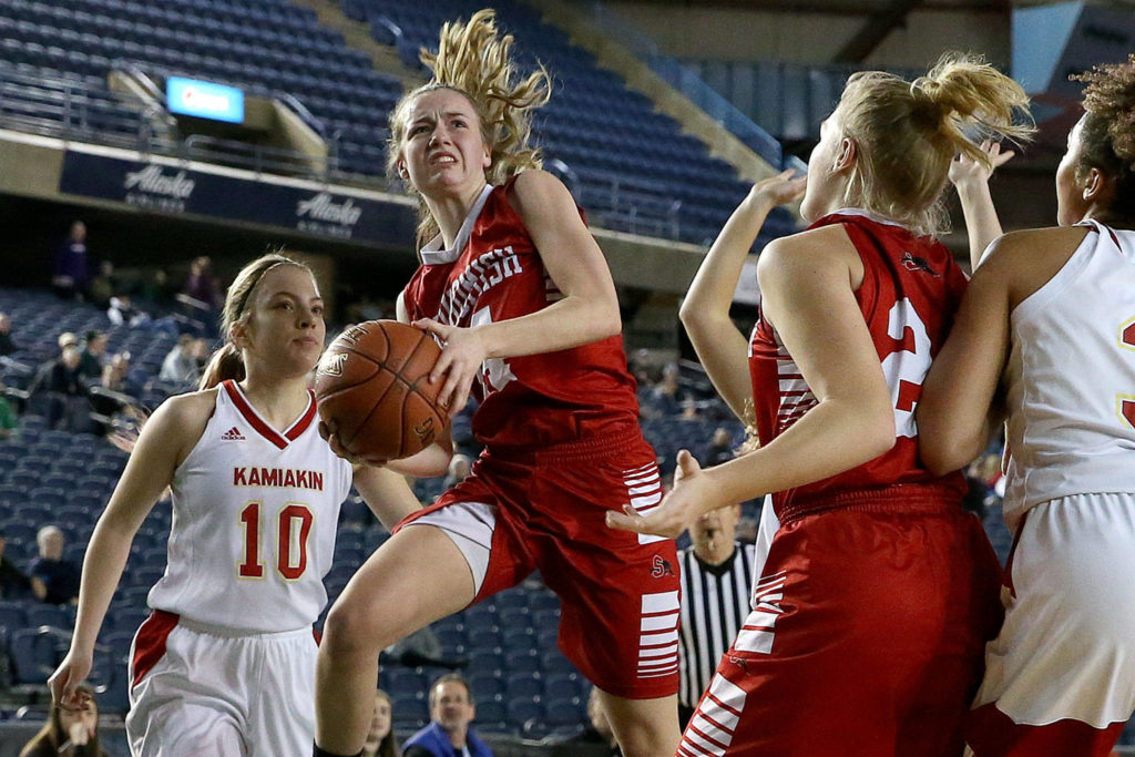 Snohomish’s Maya DuChesne attempts a shot with Kamiakin’s Regan Clark (left) looking on Thursday morning at the Tacoma Dome on February 28, 2019. The Panthers lost 57-39.(Kevin Clark / The Herald)
