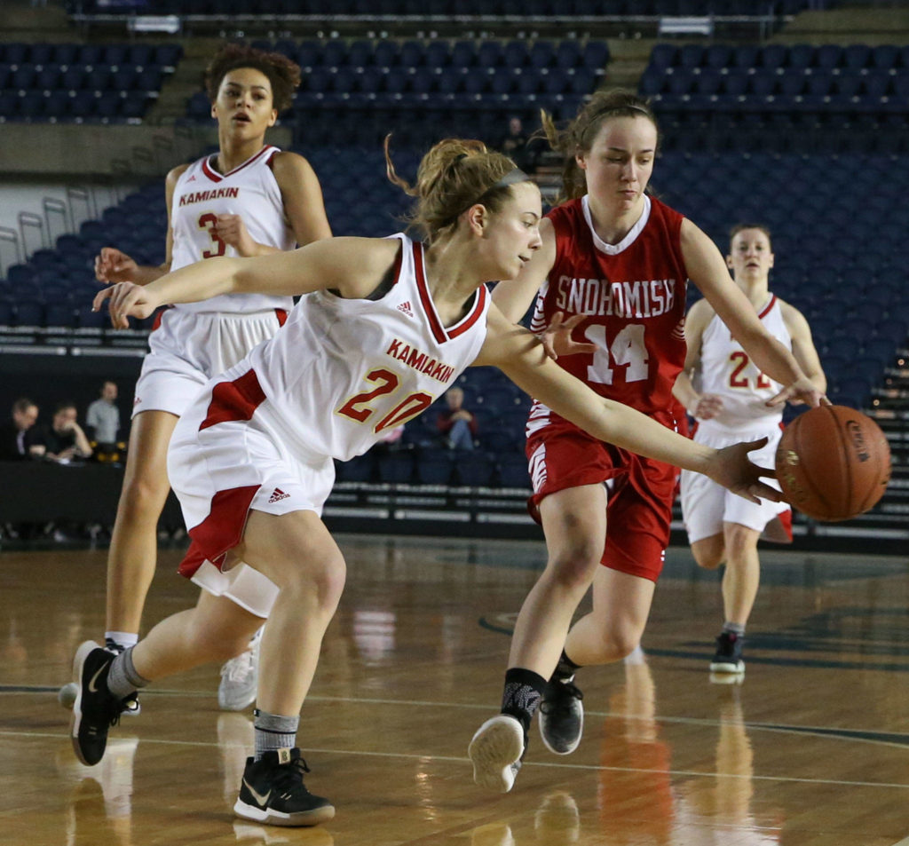 Kamiakin’s Rylie Clark attempts a steal from Snohomish’s Maya DuChesne Thursday morning at the Tacoma Dome on February 28, 2019. The Panthers lost 57-39.(Kevin Clark / The Herald)
