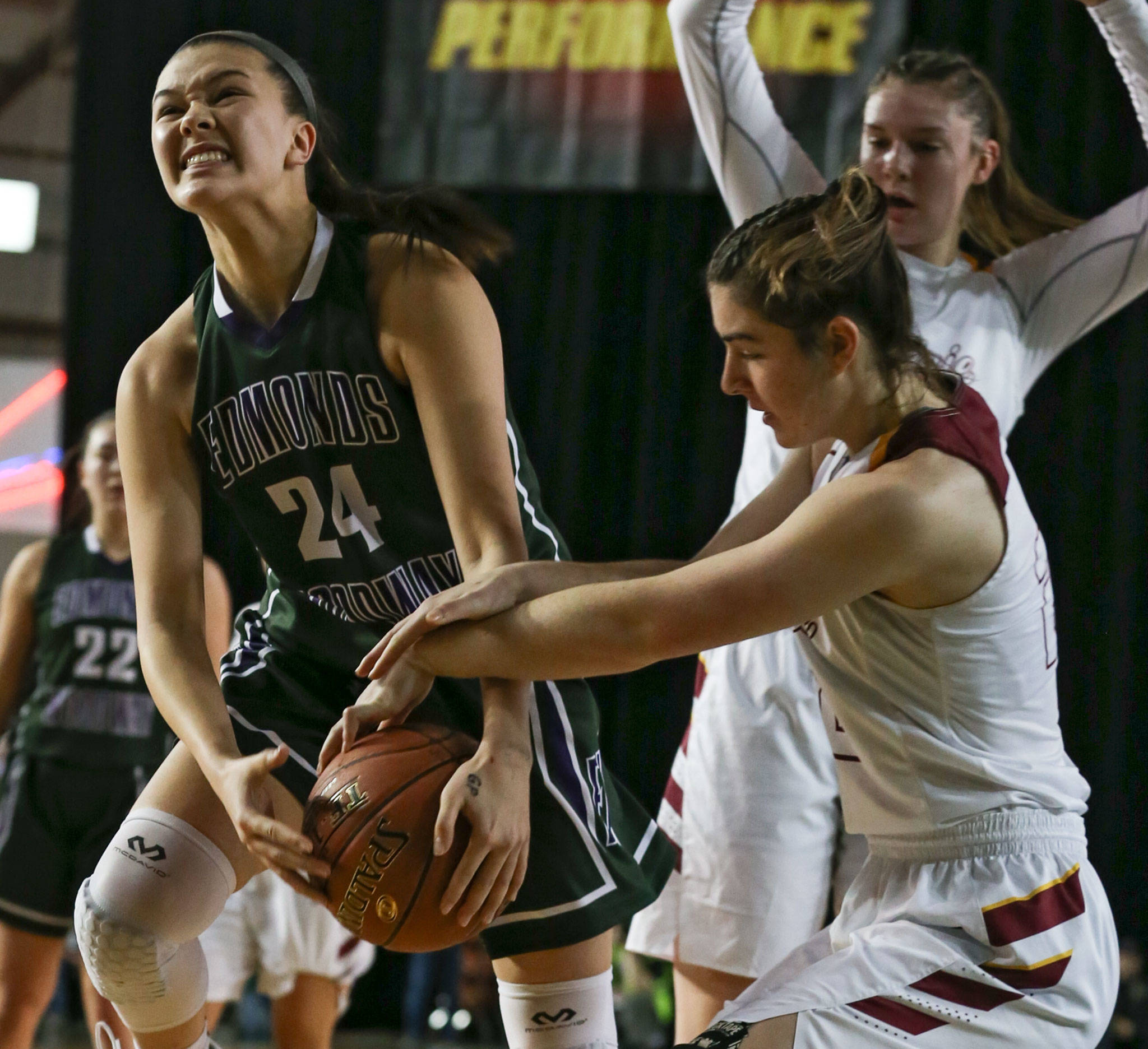 Edmonds-Woodway’s Rebekah Dasalla is tied up by Prairie’s Haley Reed Thursday morning at the Tacoma Dome on February 28, 2019. The Warriors lost 58-39.(Kevin Clark / The Herald)