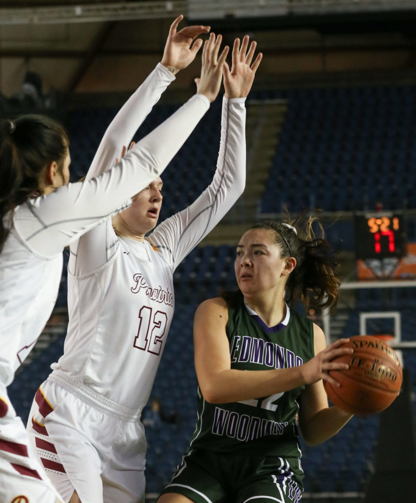 Edmonds-Woodway’s Maddie McMahon is confronted by a wall of Prairie defenders Thursday morning at the Tacoma Dome on February 28, 2019. The Warriors lost 58-39.(Kevin Clark / The Herald)
