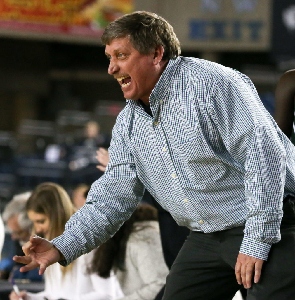 Jon Rasmussen, Edmonds-Woodway head coach, celebrates a 3-pointer Thursday morning at the Tacoma Dome on February 28, 2019. The Warriors lost 58-39.(Kevin Clark / The Herald)
