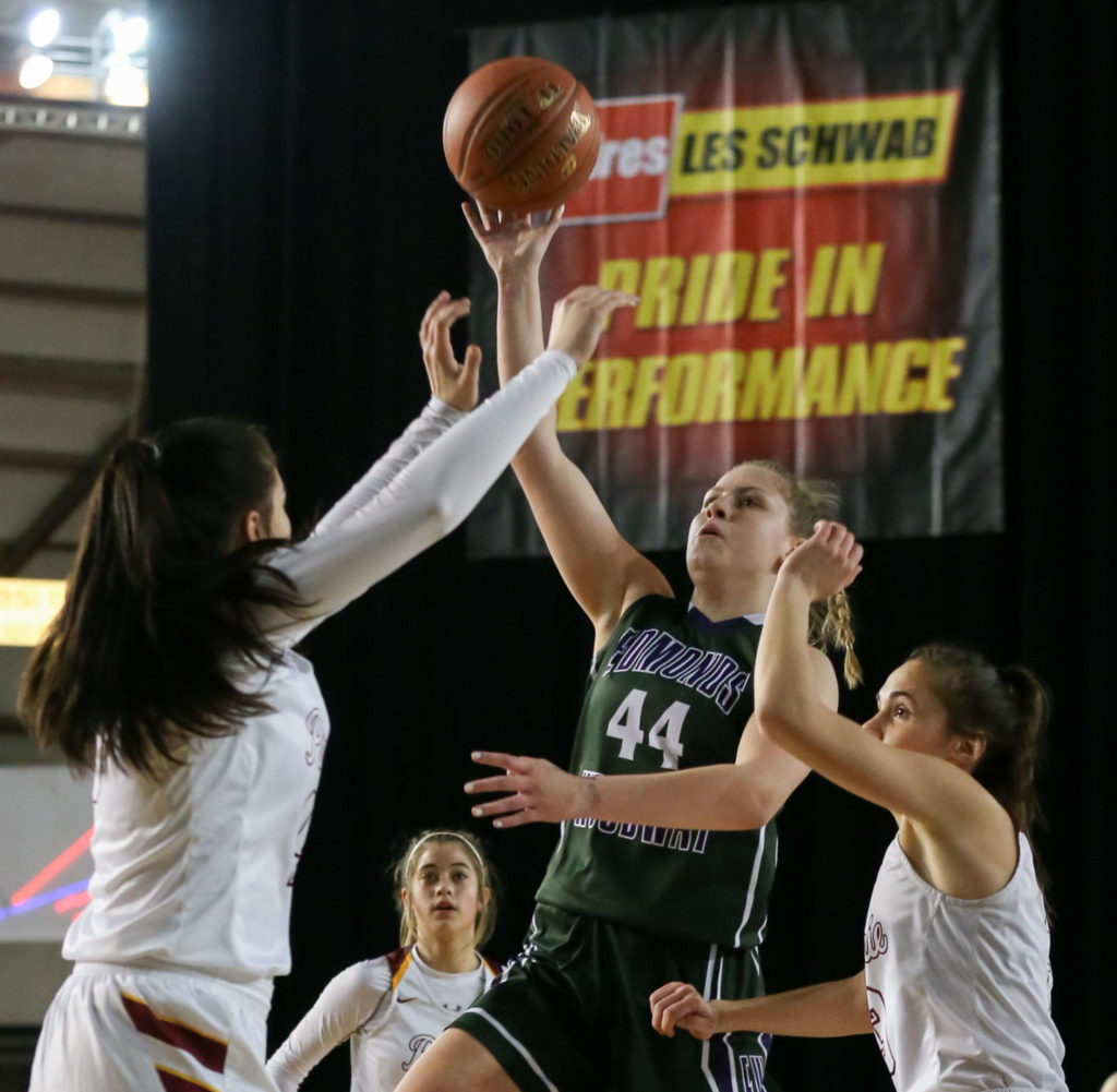 Edmonds-Woodway’s Adrienne Poling attempts a floater over Prairie defense Thursday morning at the Tacoma Dome on February 28, 2019. The Warriors lost 58-39.(Kevin Clark / The Herald)
