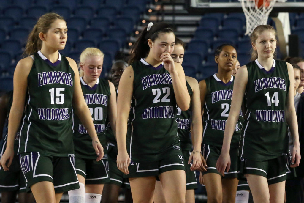Edmonds-Woodway walks off the court after loosing to Prairie Thursday morning at the Tacoma Dome on February 28, 2019. The Warriors lost 58-39.(Kevin Clark / The Herald)
