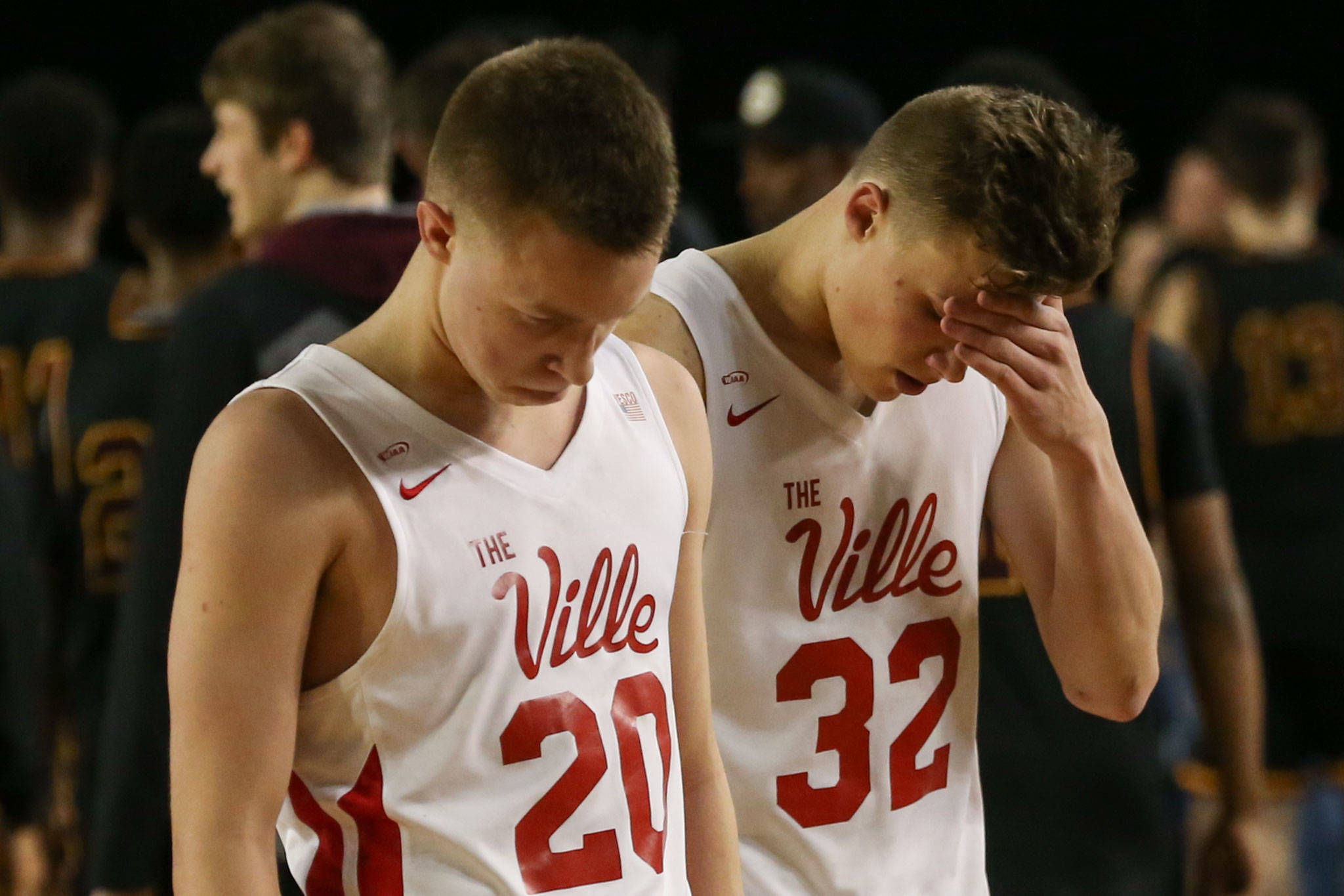 Marysville-Pilchuck’s Luke Dobler and Aaron Kalab leave the court after losing to O’Dea Thursday afternoon at the Tacoma Dome on February 28, 2019. The Tomahawks lost 63-53. (Kevin Clark / The Herald)
