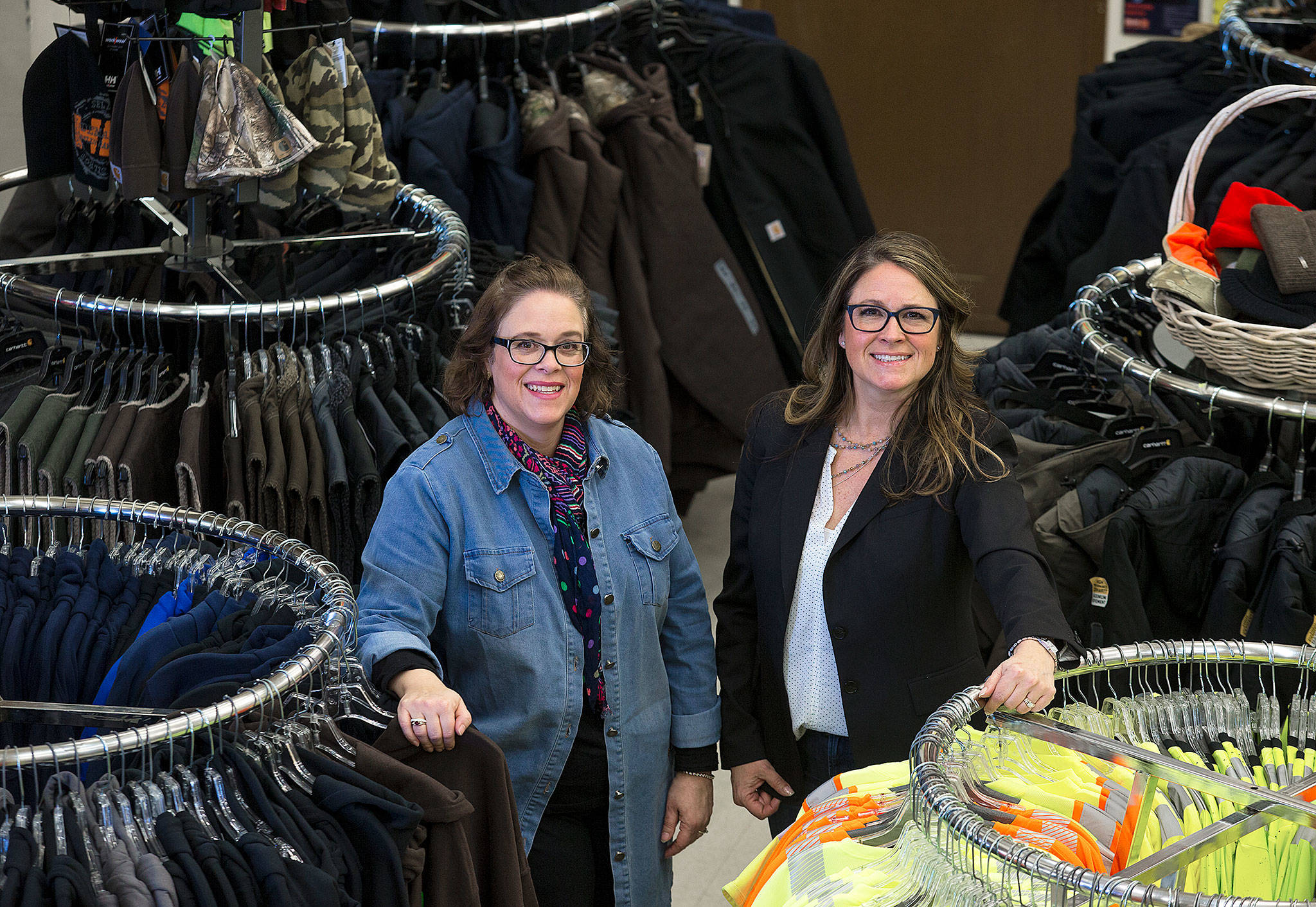 Work n’ More, based in Everett, has been around for 43 years. Sisters Cindy Calvert (left) and Wendy Olmstead bought it from their father in 2011. (Andy Bronson / The Herald)