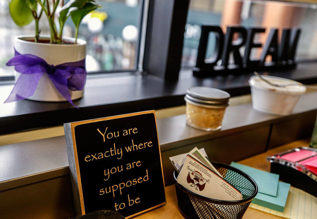Near a window in her Monroe office, Ciera Graham, the new director of EvCC’s East County Campus, keeps a few inspirational reminders. The plaque was a gift from a former co-worker at WSU Everett. (Dan Bates / The Herald)
