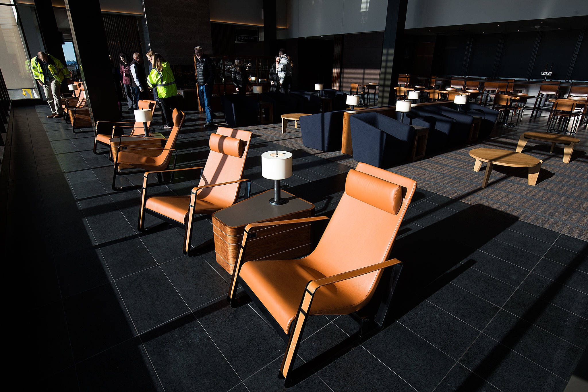 Guests tour the departure lounge of the Paine Field terminal on Tuesday. (Andy Bronson / The Herald)