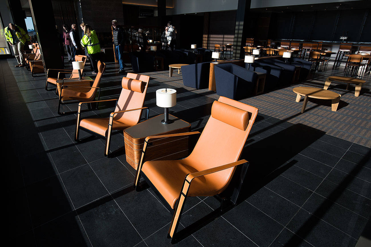 Guests tour the departure lounge of the Paine Field terminal on Tuesday. (Andy Bronson / The Herald)