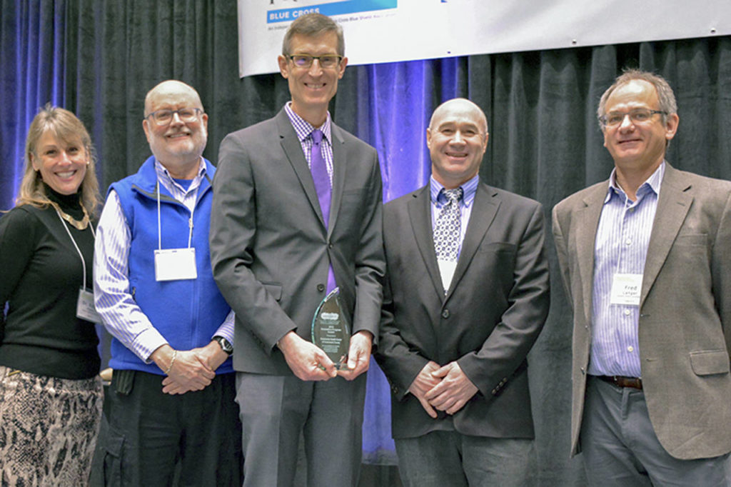 Dr. Tom Tocher (center) of Community Health Center of Snohomish County accepts the Innovative Program Award from (left to right) Verdant Superintendent Dr. Robin Fenn, Commissioner Dr. Jim Distelhorst, Commissioner Bob Knowles, and Commissioner Fred Langer at the Verdant Healthier Community Conference. (Submitted photo)
