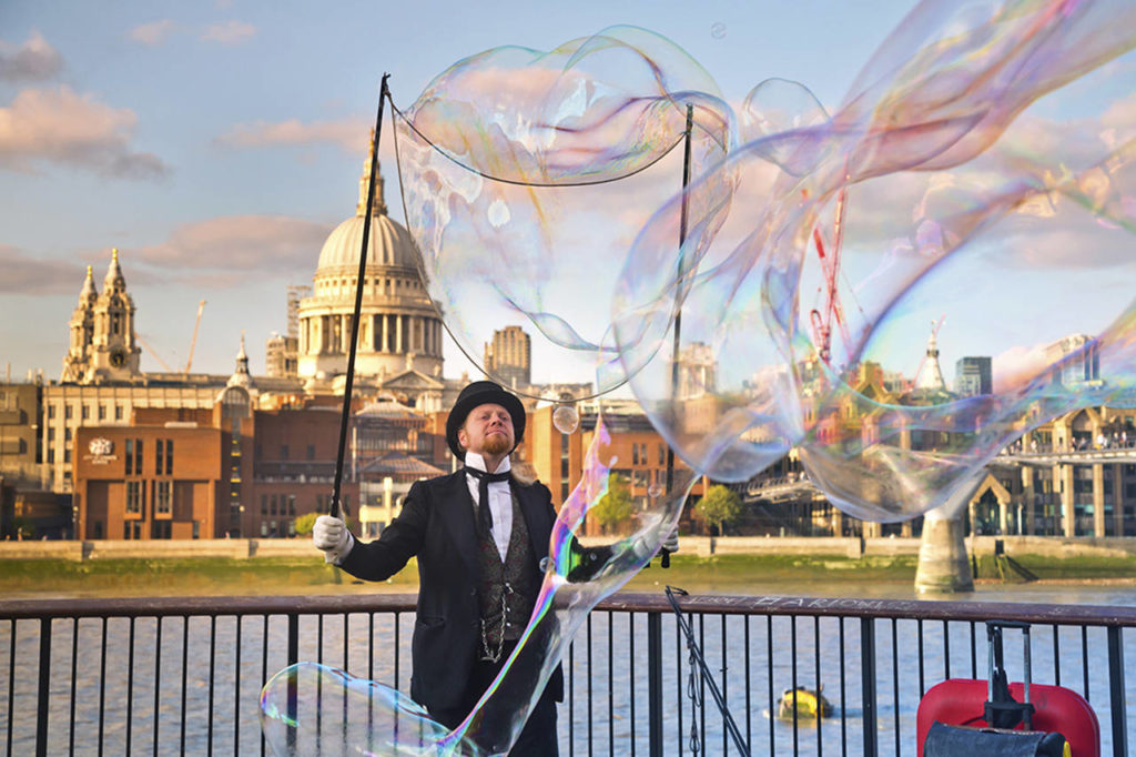 A street performer in London, with St. Paul’s Cathedral in the background. (Rick Steves’ Travel)

