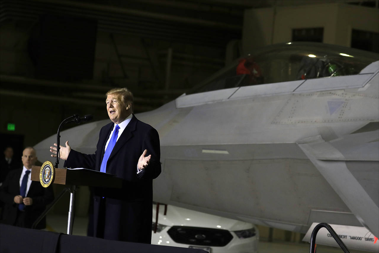 President Donald Trump speaks to service members at Joint Base Elmendorf-Richardson on Thursday in Anchorage, Alaska, during a refueling stop as he returns from Hanoi. (AP Photo/Evan Vucci)
