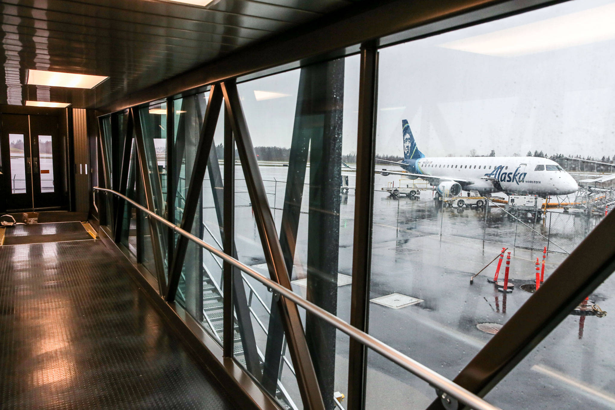 An aircraft seen from the gangway at the new airport at Paine Field in Everett on Jan. 9. (Kevin Clark / Herald file)