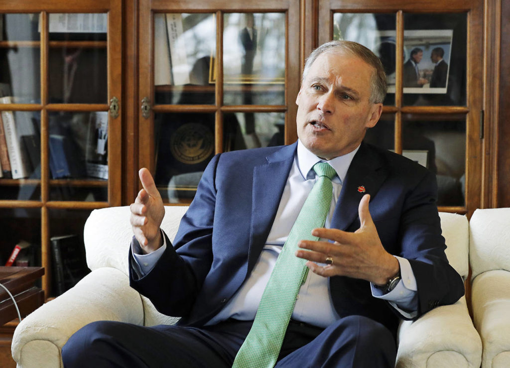 In this photo taken Jan. 24, Washington Gov. Jay Inslee takes part in an Associated Press interview in his office at the Capitol in Olympia. (AP Photo/Ted S. Warren)
