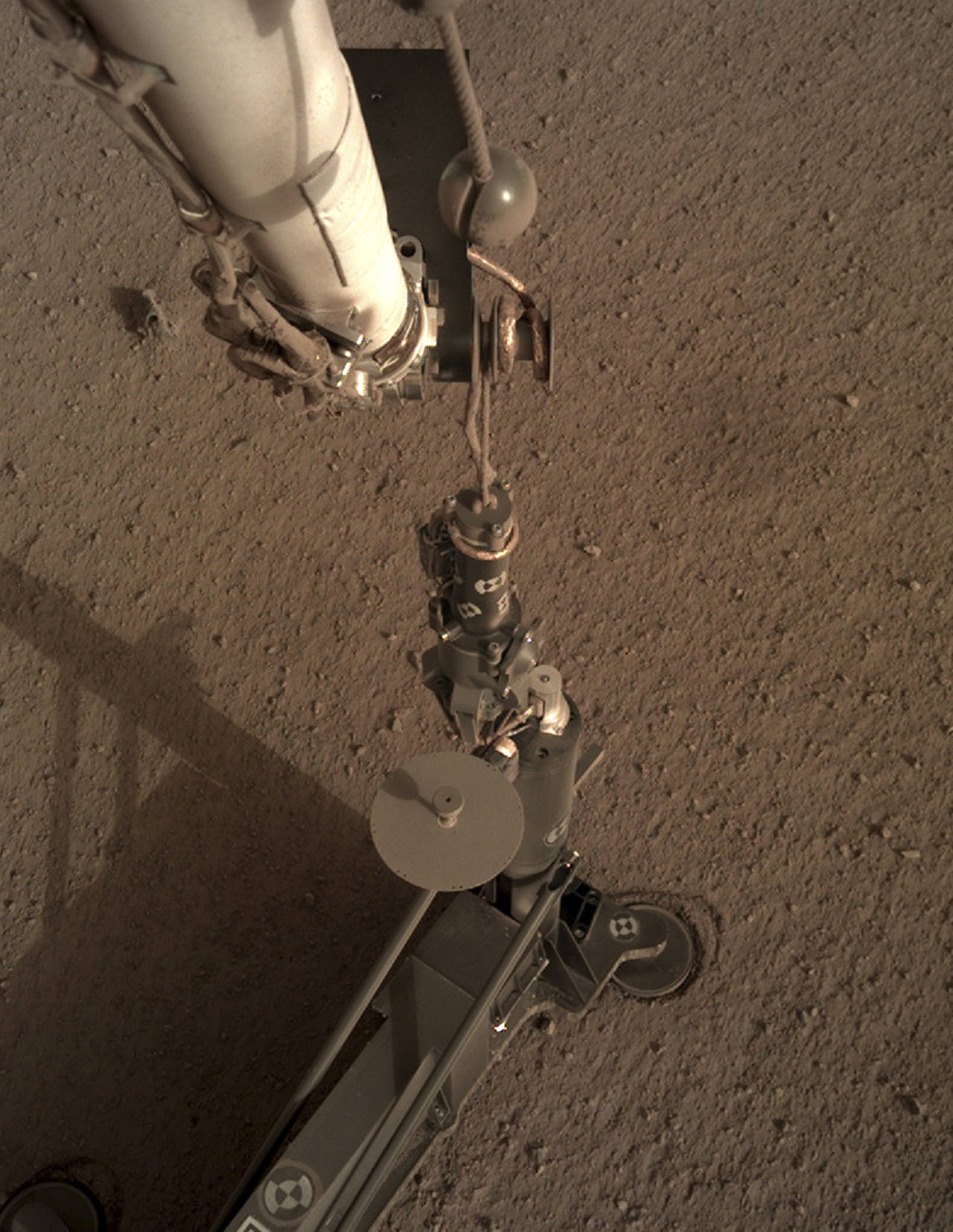 This photo shows an image acquired by NASA’s InSight Mars lander using its robotic arm-mounted, Instrument Deployment Camera (IDC). (NASA/JPL-Caltech via AP)