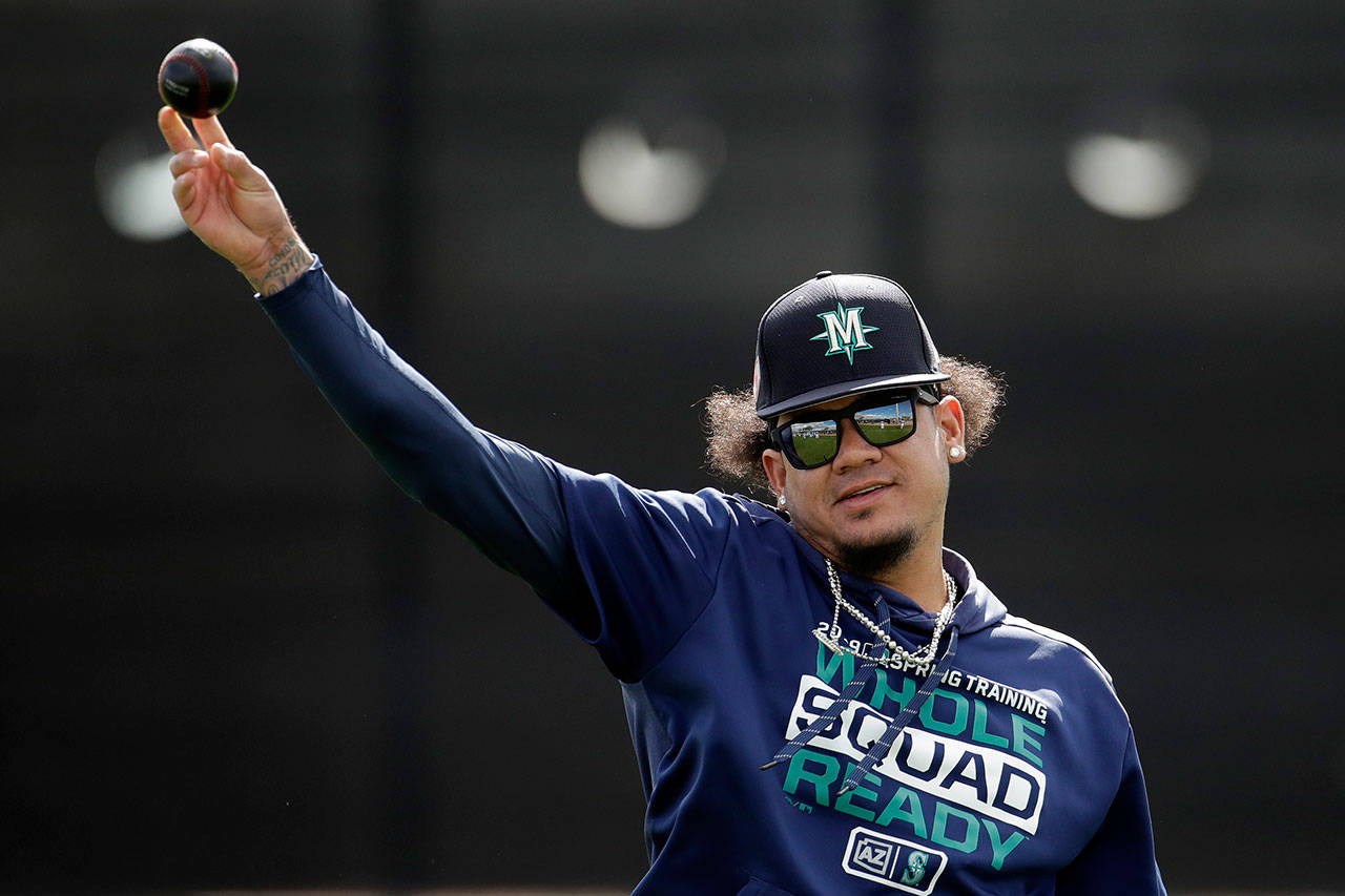 Mariners pitcher Felix Hernandez throws during a spring practice on Feb. 16, 2019, in Peoria, Ariz. (AP Photo/Charlie Riedel)