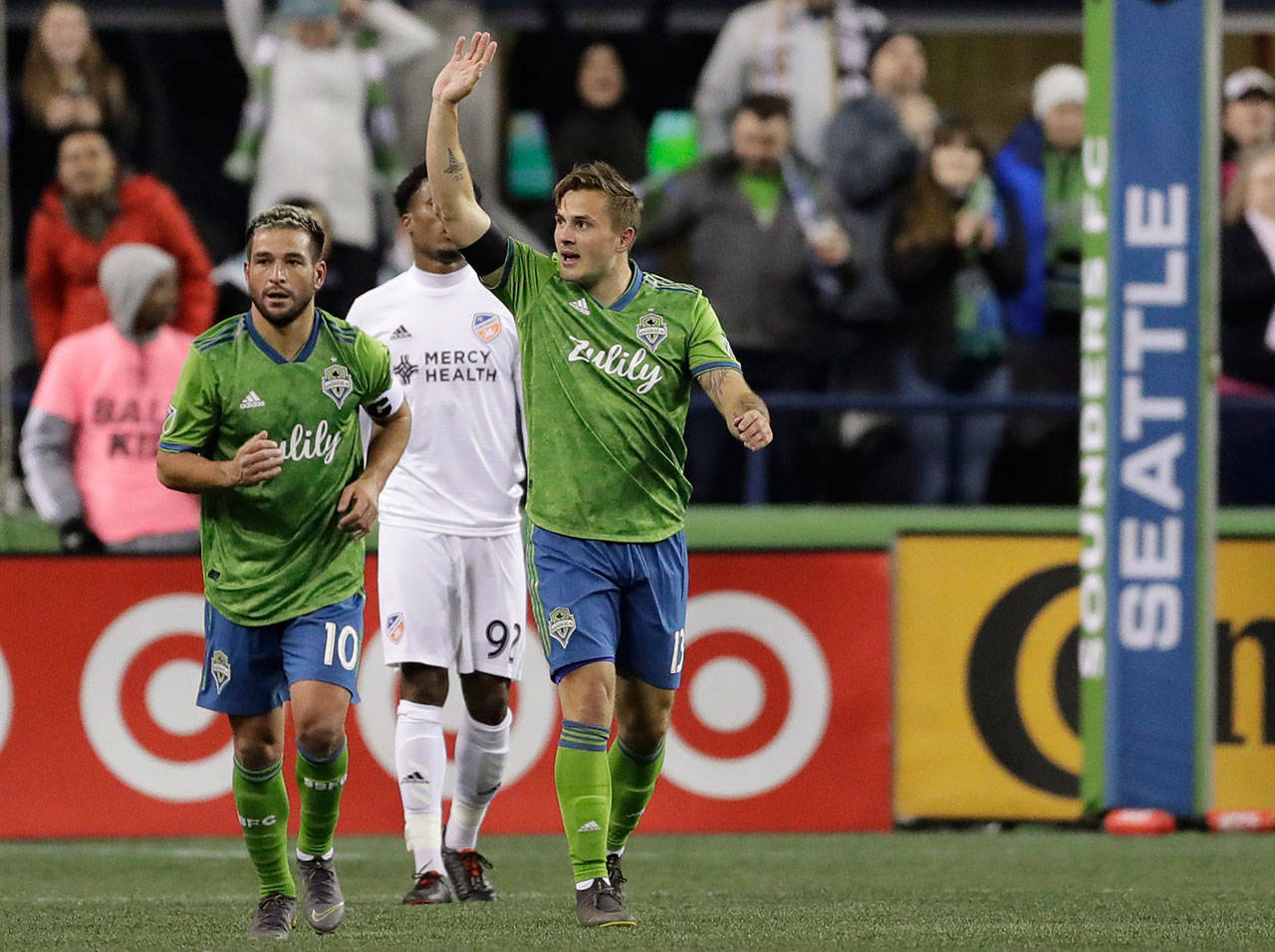 Sounders forward Jordan Morris waves to the crowd after he scored the first of his two first-half goals against FC Cincinnati during a match on March 2, 2019, in Seattle. The Sounders’ Nicolas Lodeiro (left) assisted on the goal. (AP Photo/Ted S. Warren)