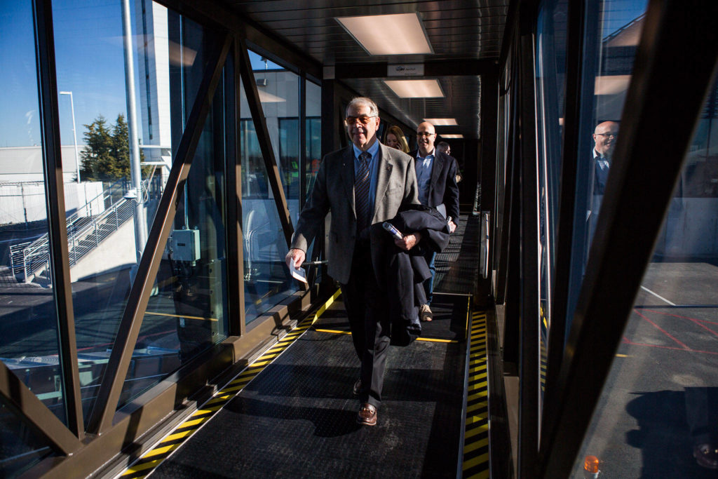 People begin boarding the first flight during the grand opening of the Paine Field Airport on March 4 in Everett. (Olivia Vanni / The Herald)
