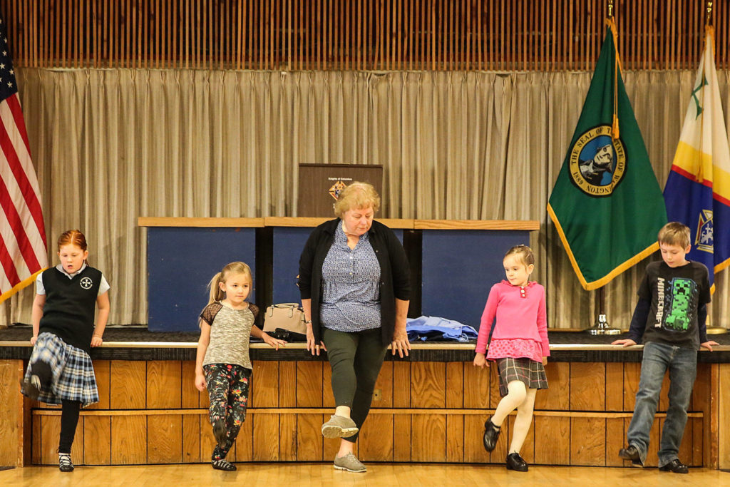 Elise Barr (left-right) Ivy Engelhardt, Heather Richendrfer, Moira Wainwright and Thaddeus Wainwright work through Irish and Scottish dance steps during a recent practice in Everett. (Kevin Clark / The Herald)
