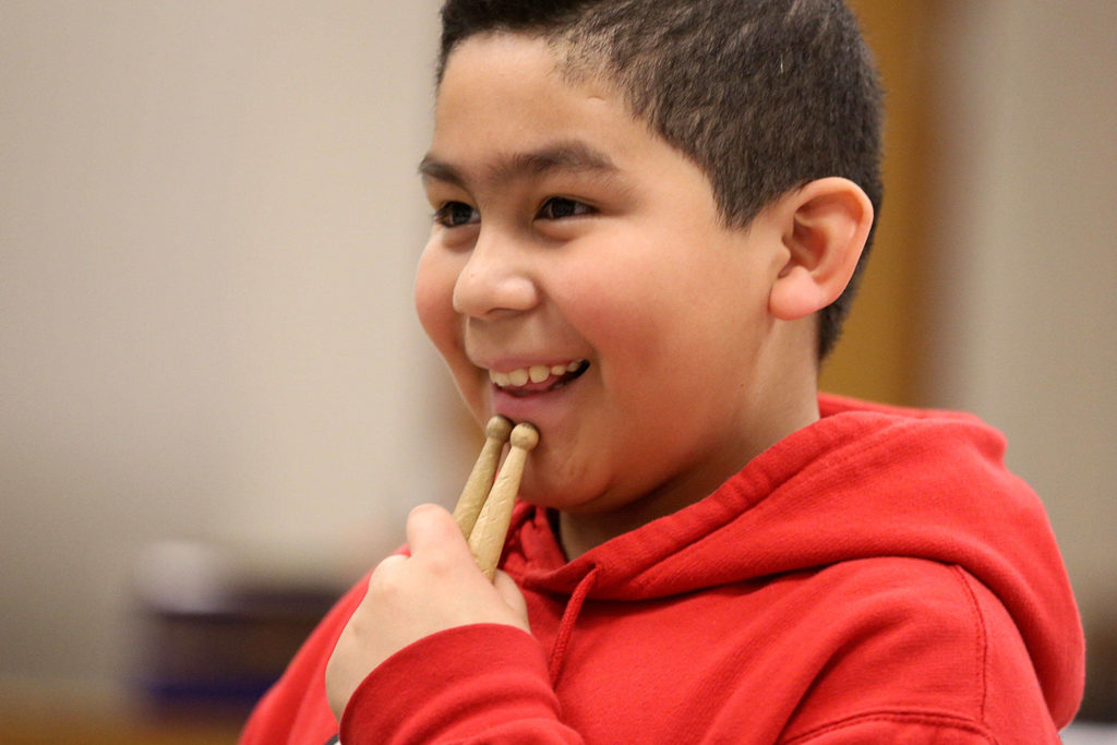 Andric Villanueva-Romero listens during percussion club at Challenger Elementary in Everett. (Kevin Clark / The Herald)
