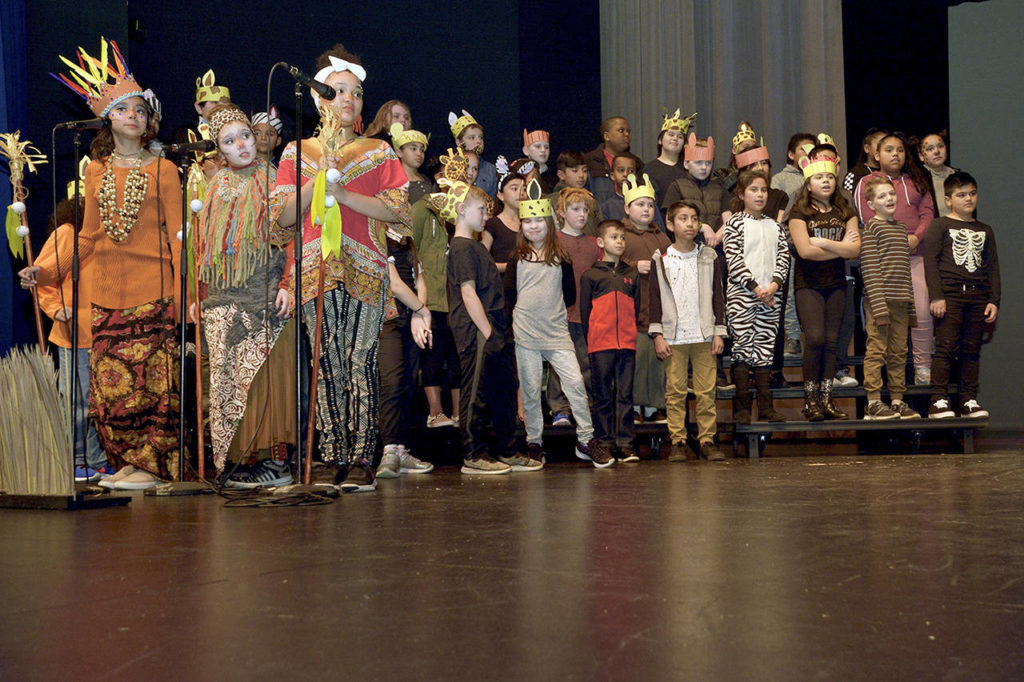 Rafikis, left to right, Alexa Maldonado, Lyleth King, Choncie LeFall and partial choir. (Kim Burke)
