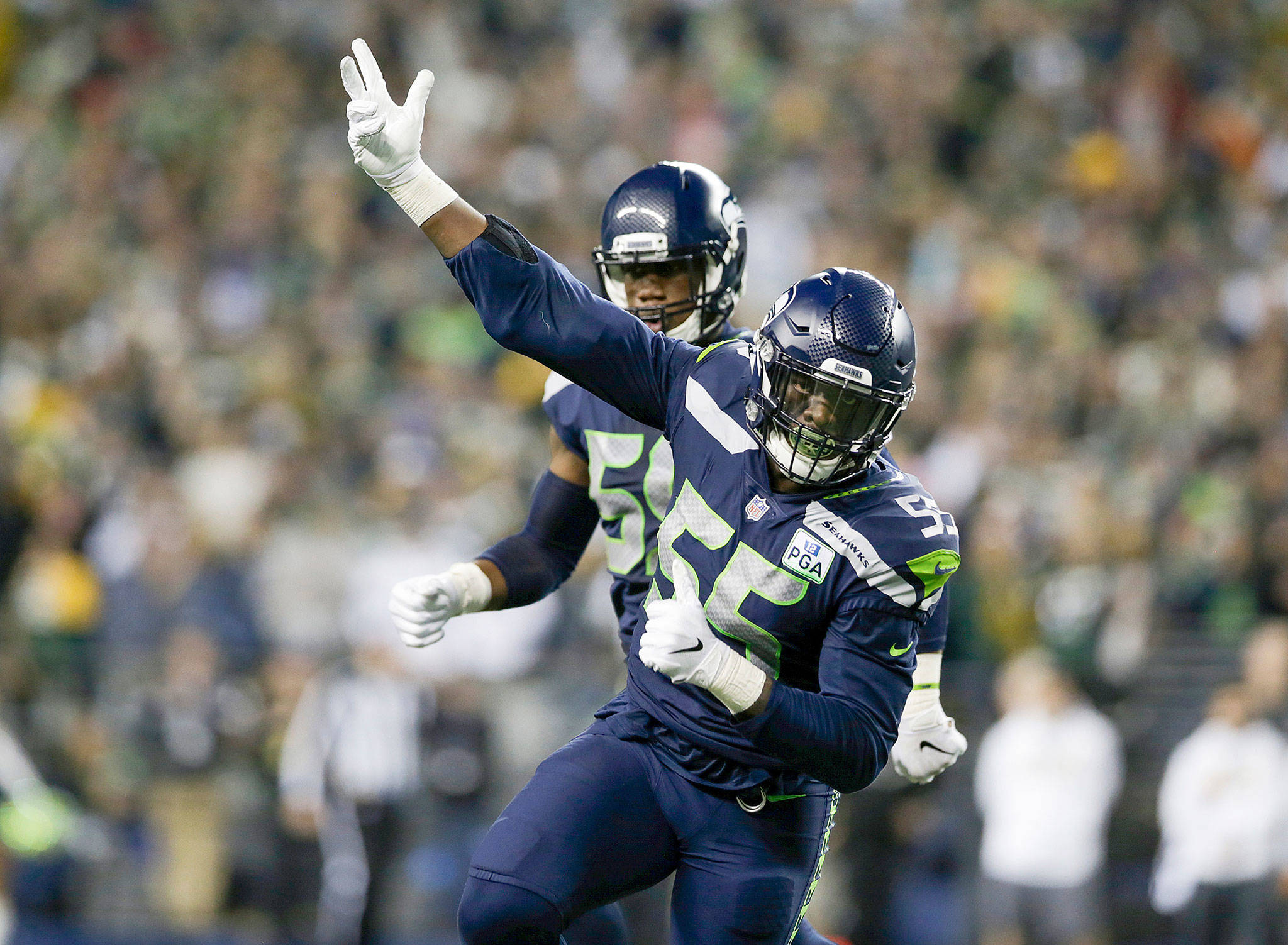Seattle’s Frank Clark celebrates after sacking Green Bay’s Aaron Rodgers during a Nov. 15, 2018 game in Seattle. (Andy Bronson / The Herald)