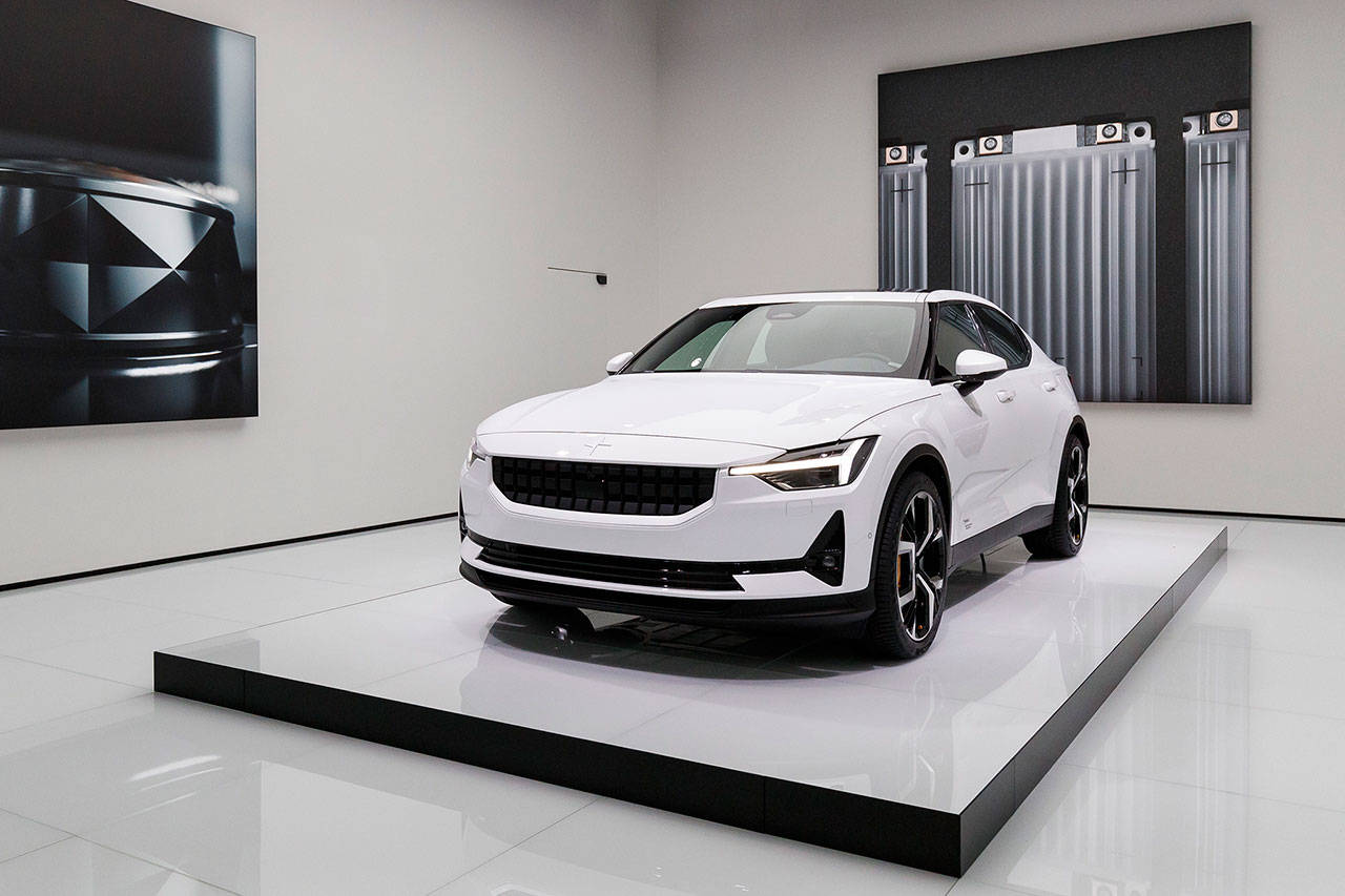 The new Polestar 2 is presented during the press day at the 89th Geneva International Motor Show in Geneva, Switzerland, Tuesday. The Geneva International Motor Show takes place in Switzerland from Thursday until March 17. Automakers are rolling out new electric and hybrid models at the show as they get ready to meet tougher emissions requirements in Europe while not forgetting the profitable and popular SUVs and SUV-like crossovers. (Cyril Zingaro/Keystone via AP)