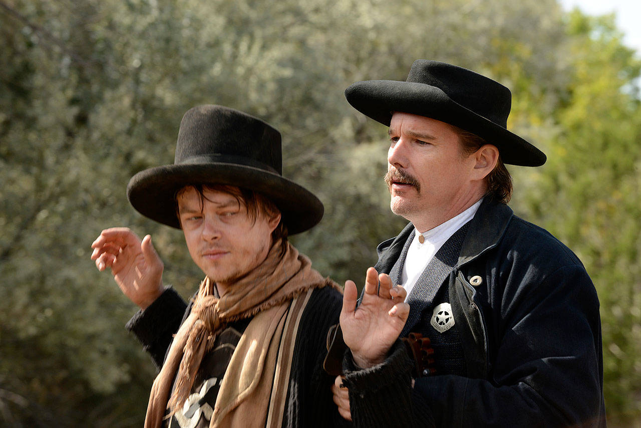 Dane DeHaan (left) plays Billy the Kid and and Ethan Hawke portrays Pat Garrett in “The Kid.” (Lionsgate)