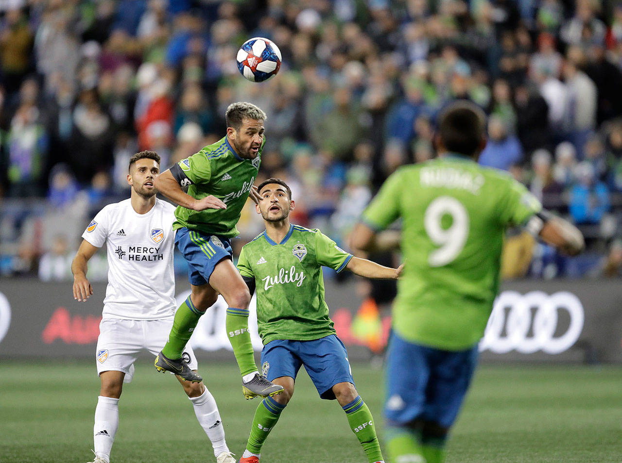Sounders midfielder Nicolas Lodeiro (second from left) heads the ball during a match against FC Cincinnati on March 2, 2019, in Seattle. (AP Photo/Ted S. Warren)