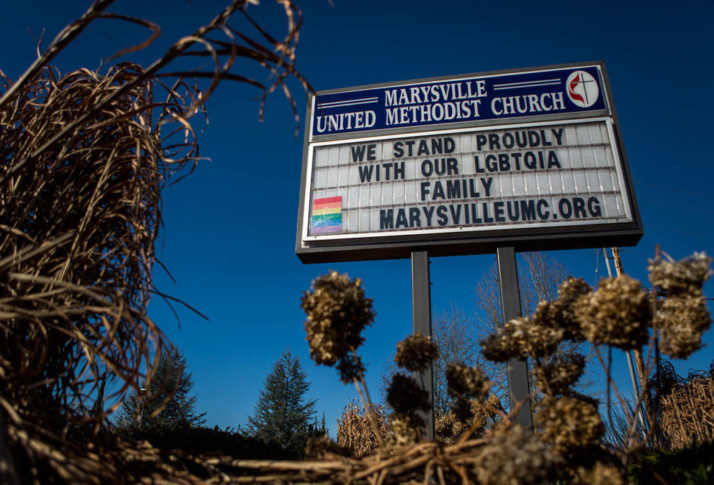 The sign for the Marysville United Methodist Church displays an LGBTQIA flag and a message of support for the community during Sunday service at Marysville United Methodist Church on March 10. (Olivia Vanni / The Herald)
