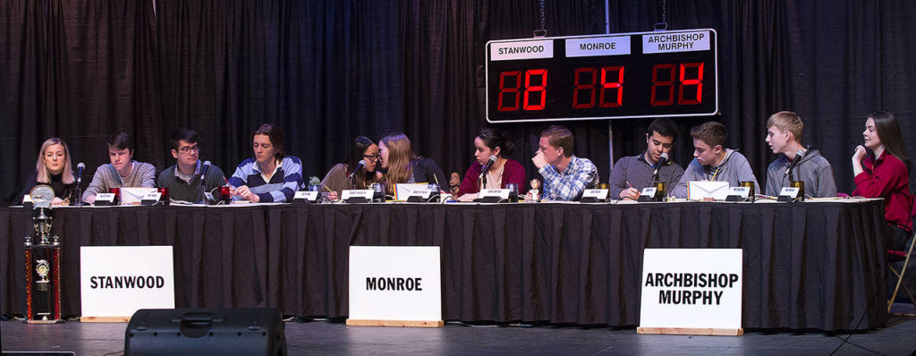 Teams from Stanwood, Monroe and Archbishop Murphy ponder the answer to a question during the Hi-Q academic quiz competition championship at Stanwood High School on Friday. (Andy Bronson / The Herald) 
