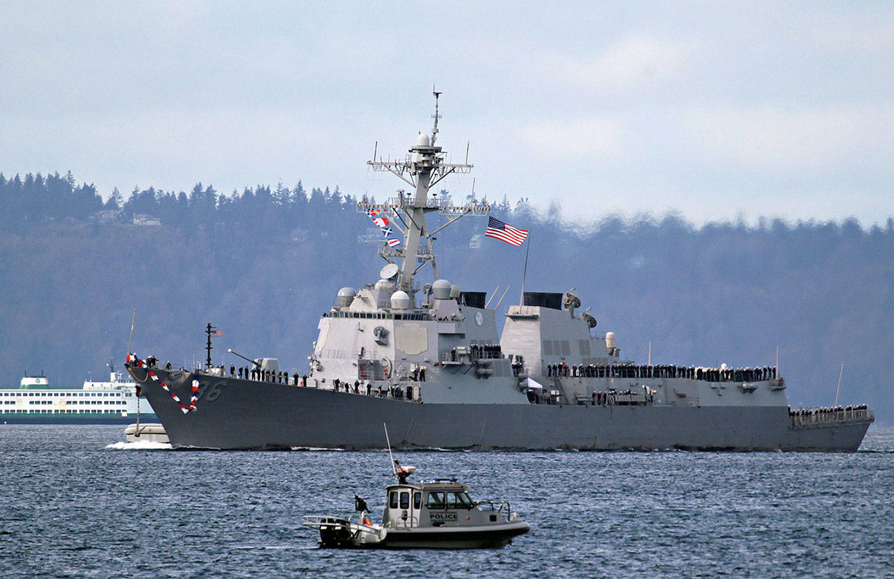 The USS Shoup steers towards its home port at Naval Station Everett after a 6-month deployment on March 28, 2011. (Mark Mulligan / Herald file)