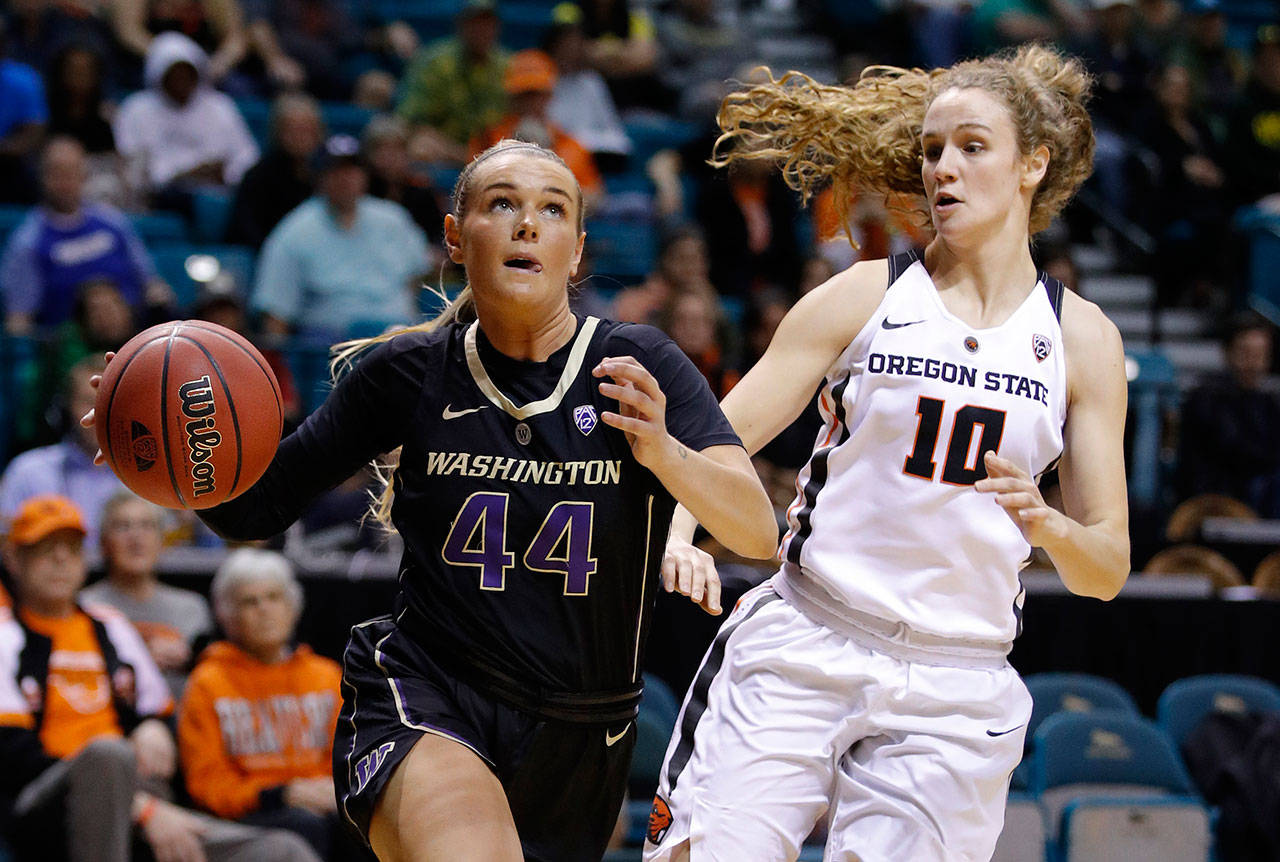 Washington’s Missy Peterson drives past Oregon State’s Katie McWilliams during a Pac-12 women’s tournament game on March 8, 2019, in Las Vegas. (AP Photo/John Locher)