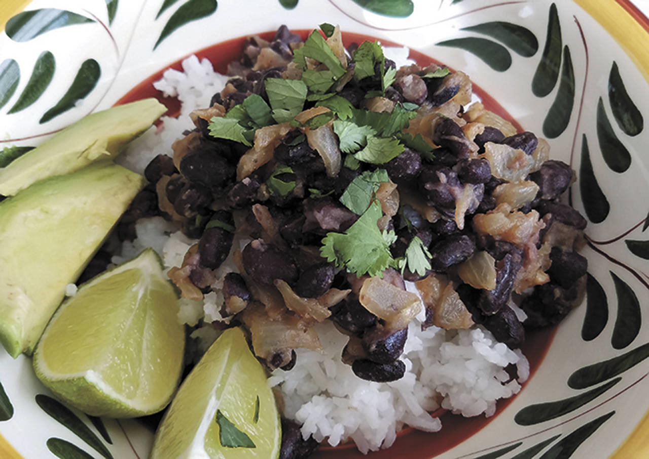 This “no-recipe-recipe” for rice and beans is made with orange juice, fresh cilantro and ground cumin. (Sharon Salyer/The Herald)