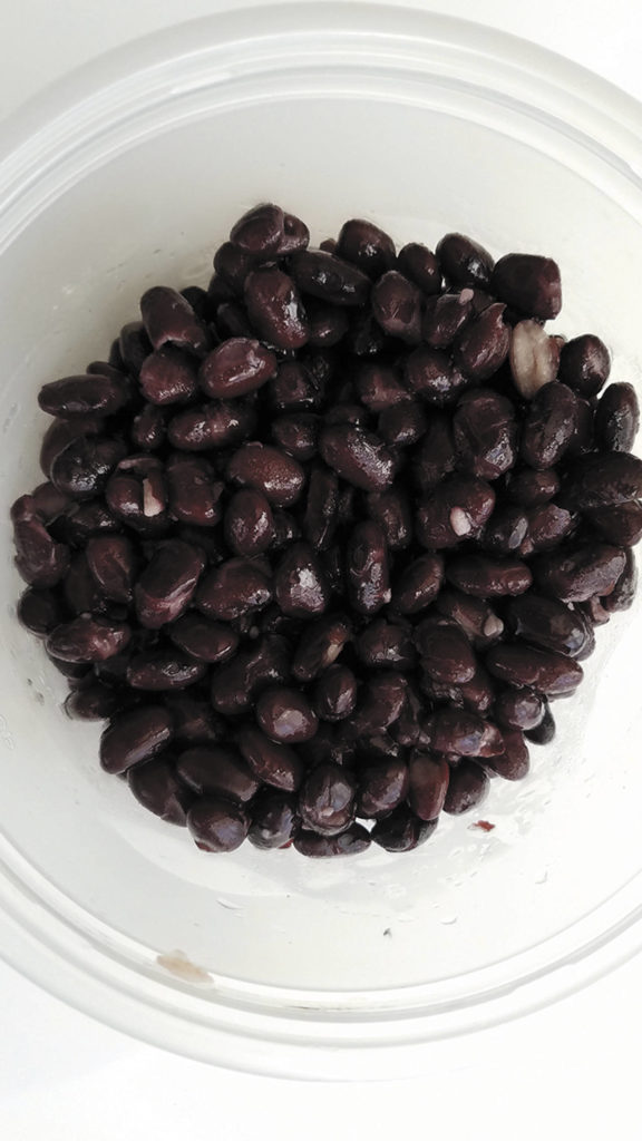 Give the canned black beans a good rinse. They can be a little gooey coming out of the can. (Sharon Salyer/The Herald)
