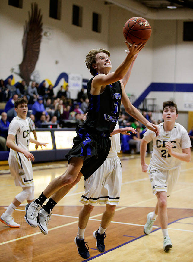 South Whidbey’s Kody Newman goes for a layup in a game against Cedar Park Christian on Jan. 11, 2019 at Cedar Park Christian High School. (Andy Bronson / The Herald)