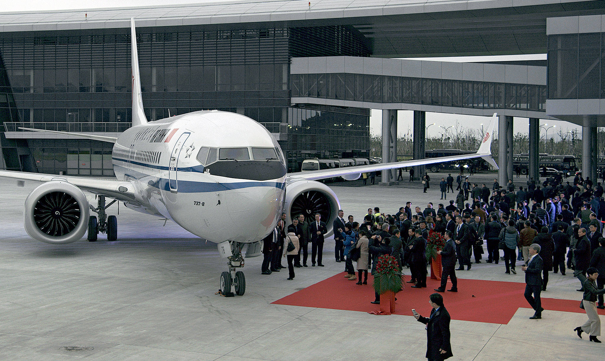 Guests look at a Boeing 737 MAX 8 airplane after it was delivered to Air China Dec. 15 at Boeing Zhoushan 737 Completion and Delivery Center. (Chinatopix via AP)