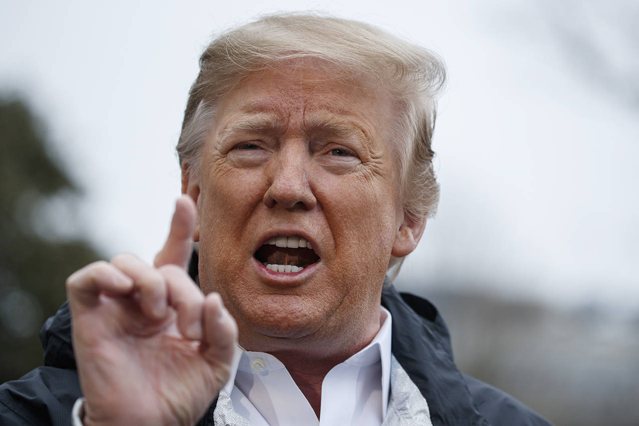 In this March 8 photo, President Donald Trump talks with reporters outside the White House in Washington. (AP Photo/ Evan Vucci)