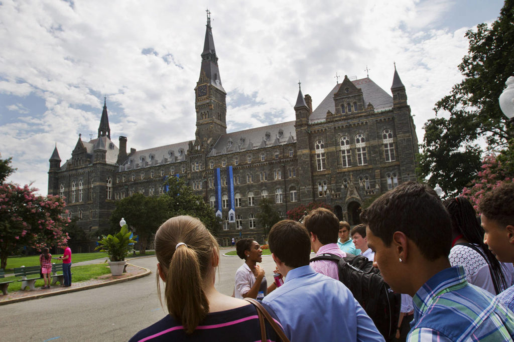 In this 2013, photo, prospective students tour Georgetown University’s campus in Washington. (AP Photo/Jacquelyn Martin, File)
