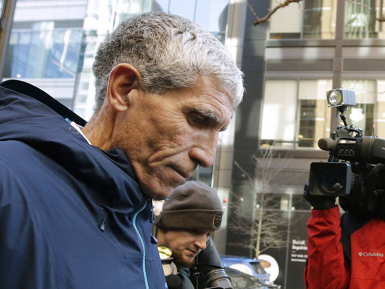 William “Rick” Singer, founder of the Edge College & Career Network, departs federal court in Boston on Tuesday, after he pleaded guilty to charges in a nationwide college admissions bribery scandal. (AP Photo/Steven Senne)