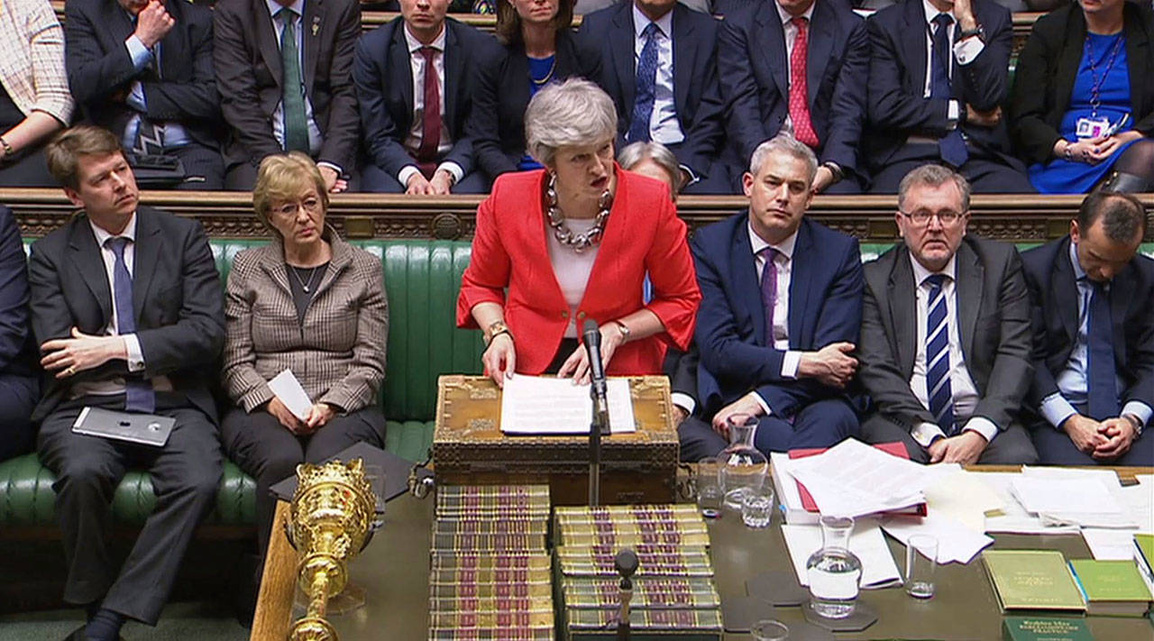 Britains Prime Minister Theresa May speaks to lawmakers in parliament, London, Tuesday. Britains Parliament delivered a crushing defeat to Prime Minister Theresa Mays European Union divorce deal Tuesday, plunging the Brexit process into chaos just 17 days before the U.K. is due to leave the bloc. (House of Commons/PA via AP)
