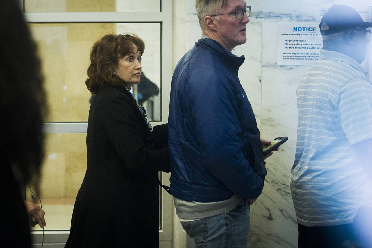 Paul Manafort’s wife, Kathleen Manafort, waits to enter the U.S. District Court for Manafort’s sentencing hearing in Washington on Wednesday, March. (AP Photo/Cliff Owen)