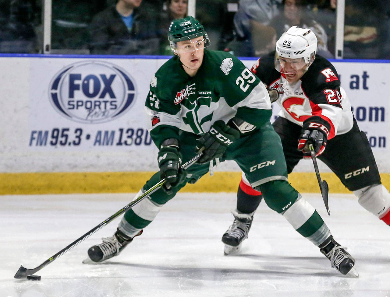The Silvertips’ Wyatte Wylie looks for a teammate to pass to with Prince George’s Kody McDonald trailing during a game in 2017. Wylie, a Snohomish County native, was a sixth-round pick for the Silvertips in the 2014 bantam draft. (Kevin Clark / The Herald)