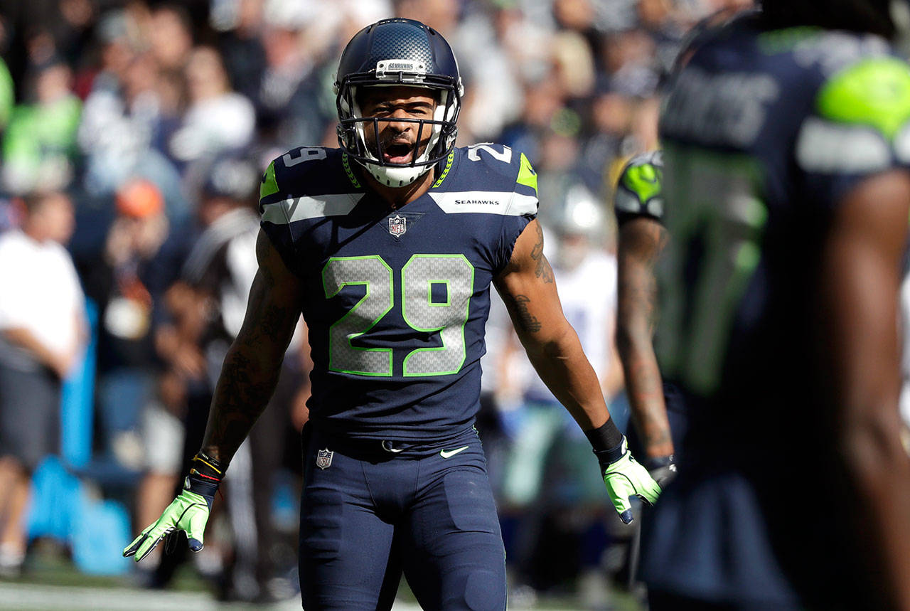 Seahawks safety Earl Thomas celebrates a play against the Cowboys during a game on Sept. 23, 2018, in Seattle. Thomas agreed to a four-year, $55 million free-agent deal with the Ravens on Wednesday. (AP Photo/Elaine Thompson)