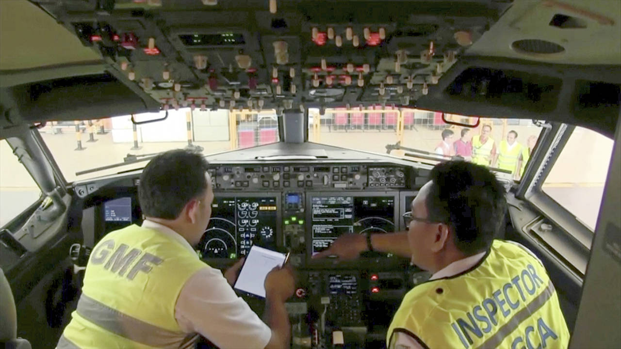 Associated Press                                Officials inspect the cockpit of a Boeing 737 Max 8 at the Garuda Maintenance Facility at Soekarno Hatta airport, Jakarta, Indonesia, on Tuesday.